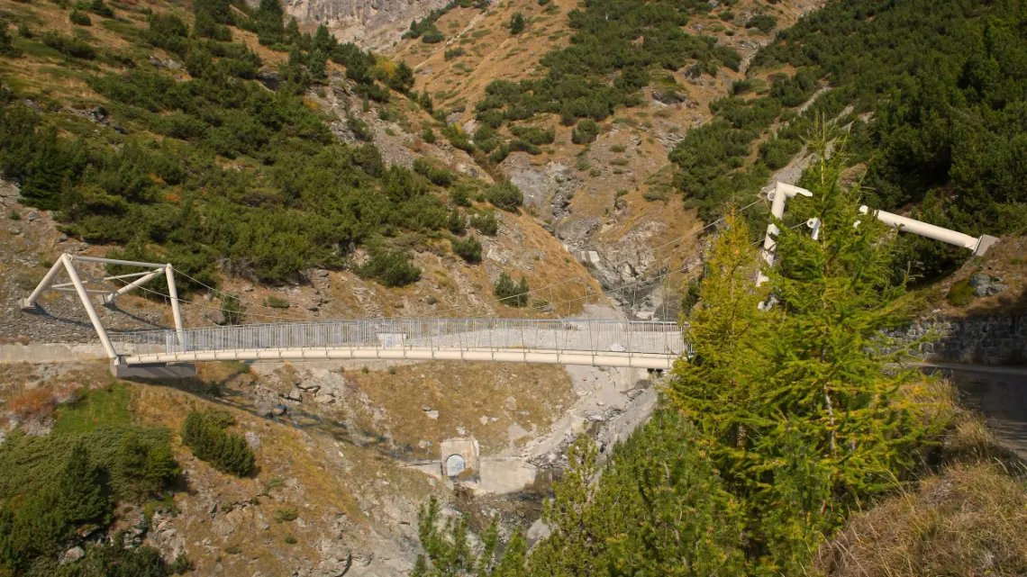 Footbridge spanning a mountain gorge