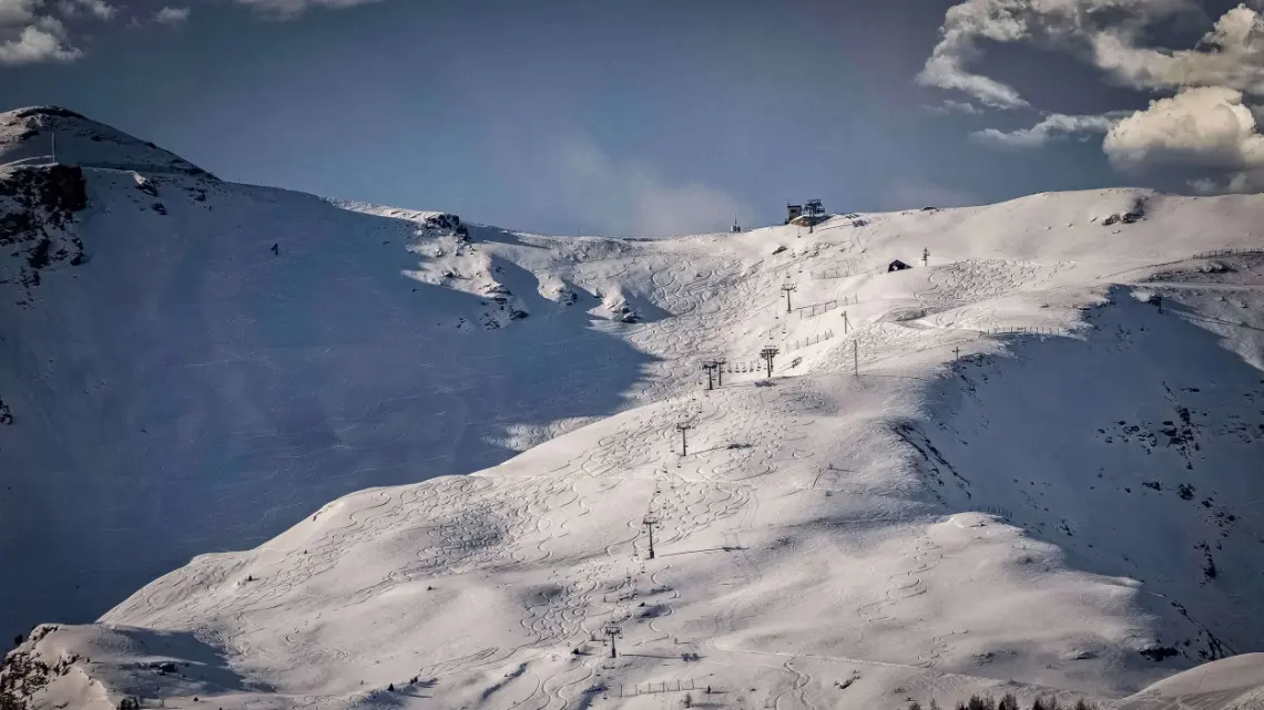 Snowy slopes of a ski area with its lifts