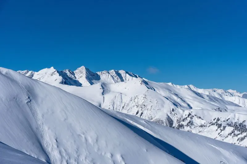 Snowy ridge under a blue sky