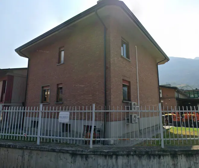 The Aosta office, a brick building on Via Garin